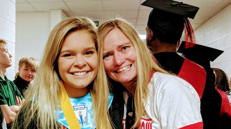 Scarlett Woodward graduated in May from Winder-Barrow High School. Although she was in the state’s dual enrollment program, none of her college credits will transfer to Columbia University in New York City. She’s seen here with her teacher Ann Locke Ridgway. CONTRIBUTED