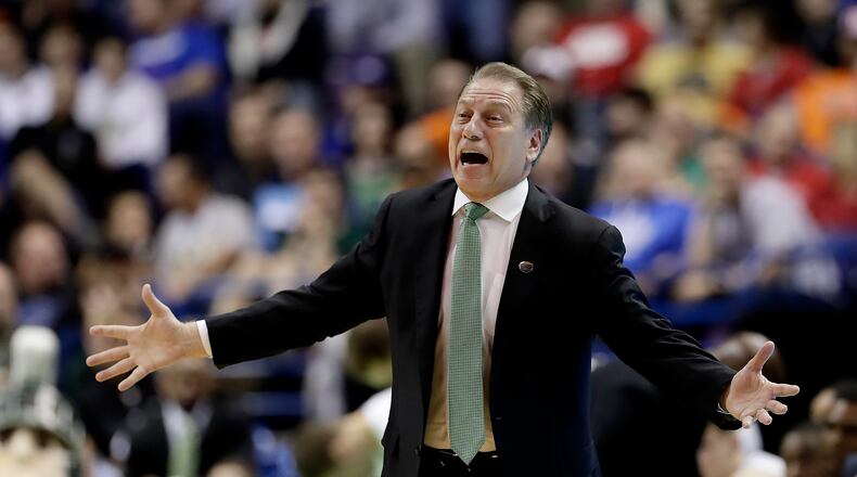 Michigan State head coach Tom Izzo talks to his players during the first half of a first-round men's college basketball game against Middle Tennessee in the NCAA Tournament, Friday, March 18, 2016, in St. Louis. (AP Photo/Charlie Riedel)