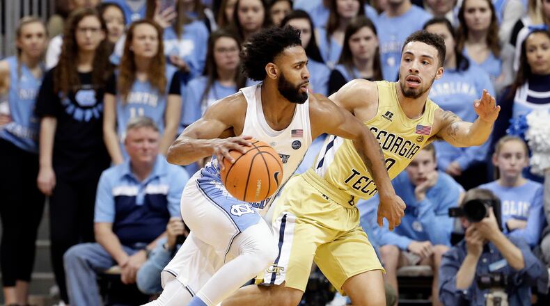 Georgia Tech's Jose Alvarado guards North Carolina's Joel Berry II during the second half of an NCAA college basketball game in Chapel Hill, N.C., Saturday, Jan. 20, 2018. North Carolina won 80-66. (AP Photo/Gerry Broome)