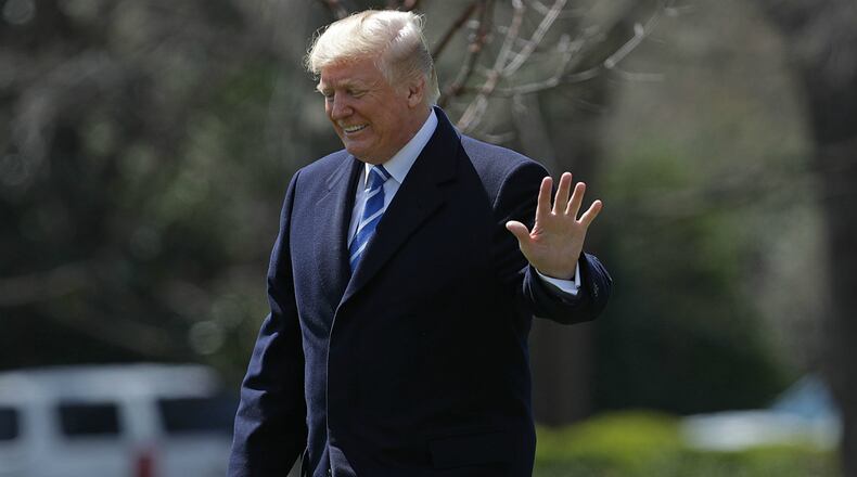 U.S. President Donald Trump walks across the South Lawn before boarding Marine One and leaving the White House April 5, 2018 in Washington, DC.
