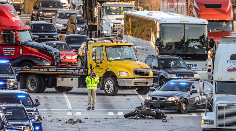 March 28, 2022 Atlanta: A fatal crash involving a motorcycle caused delays on Moreland Avenue in DeKalb County on Monday morning, March 28, 2022. At one point all southbound lanes were shut down while authorities investigated the crash at South River Industrial Boulevard, according to the Georgia Department of Transportation. The wreck was reported just after 7:30 a.m. and was cleared by just after 9 a.m. Investigators believe a driver turned left in front of the motorcycle, causing the bike to crash and killing its rider, according to DeKalb police. The motorcyclist was not identified. Charges are pending for the driver of the car, who also has not been identified, police said. Moreland Avenue was shut down while the manÕs body was removed by the DeKalb County Medical ExaminerÕs Office. His crumpled motorcycle could be seen lying in the southbound lanes. (John Spink / John.Spink@ajc.com)