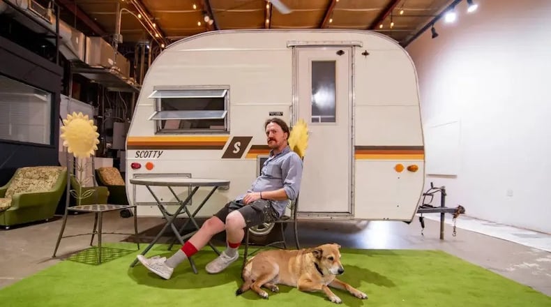 Lucas Rocheleau with his dog Ted in front of his immersive art installation. (Photo Courtesy of Isadora Pennington)