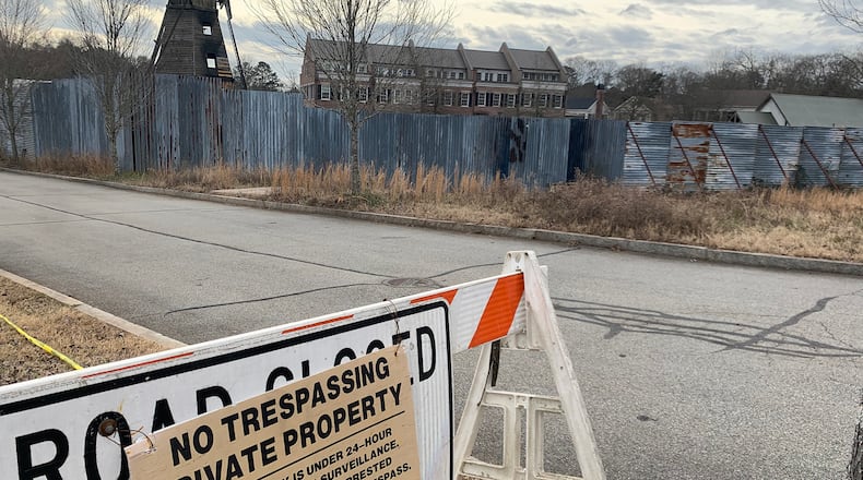 "The Walking Dead' has been using a real neighborhood for the past eight years to shoot Alexandria in Senoia. The fencing will be taken down later this spring after the show wraps after 11 years. RODNEY HO/rho@ajc.com