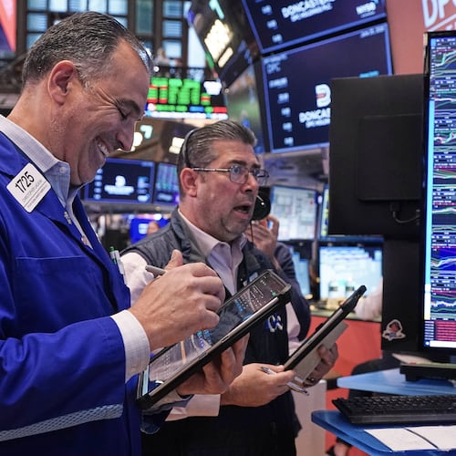 Traders Chris Lagana, left, and Michael Capolino work on the floor of the New York Stock Exchange, Thursday, June 25, 2026. (AP Photo/Richard Drew)
