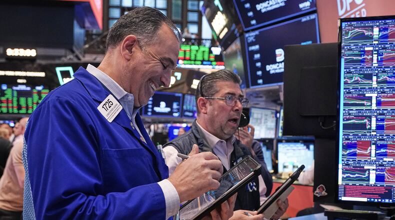 Traders Chris Lagana, left, and Michael Capolino work on the floor of the New York Stock Exchange, Thursday, June 25, 2026. (AP Photo/Richard Drew)