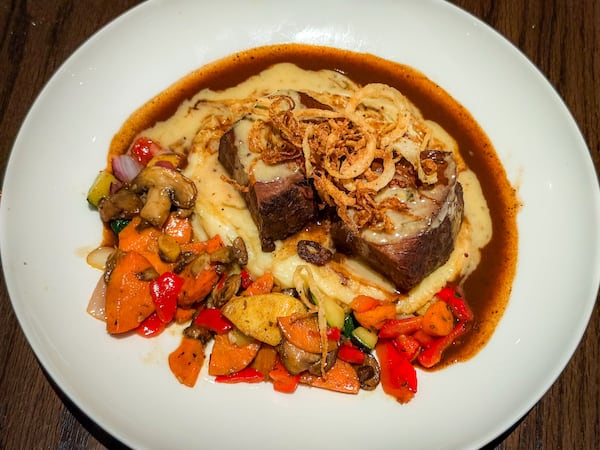 The red wine-braised short ribs dish is a solid choice while dining at Cooper's Hawk. (Henri Hollis/AJC)