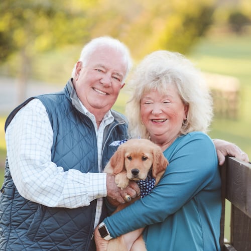 The late Joe Powell (left) with his wife, Sandy, and their dog, Lili. (Courtesy of the Powell family)