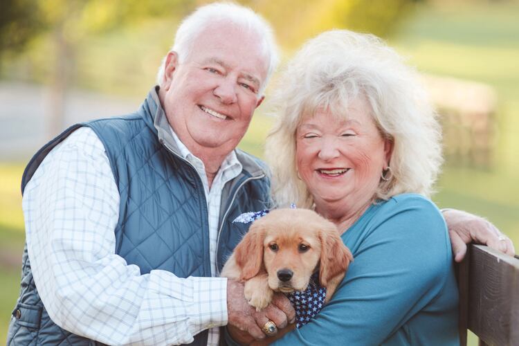 The late Joe Powell (left) with his wife, Sandy, and their dog, Lili. (Courtesy of the Powell family)