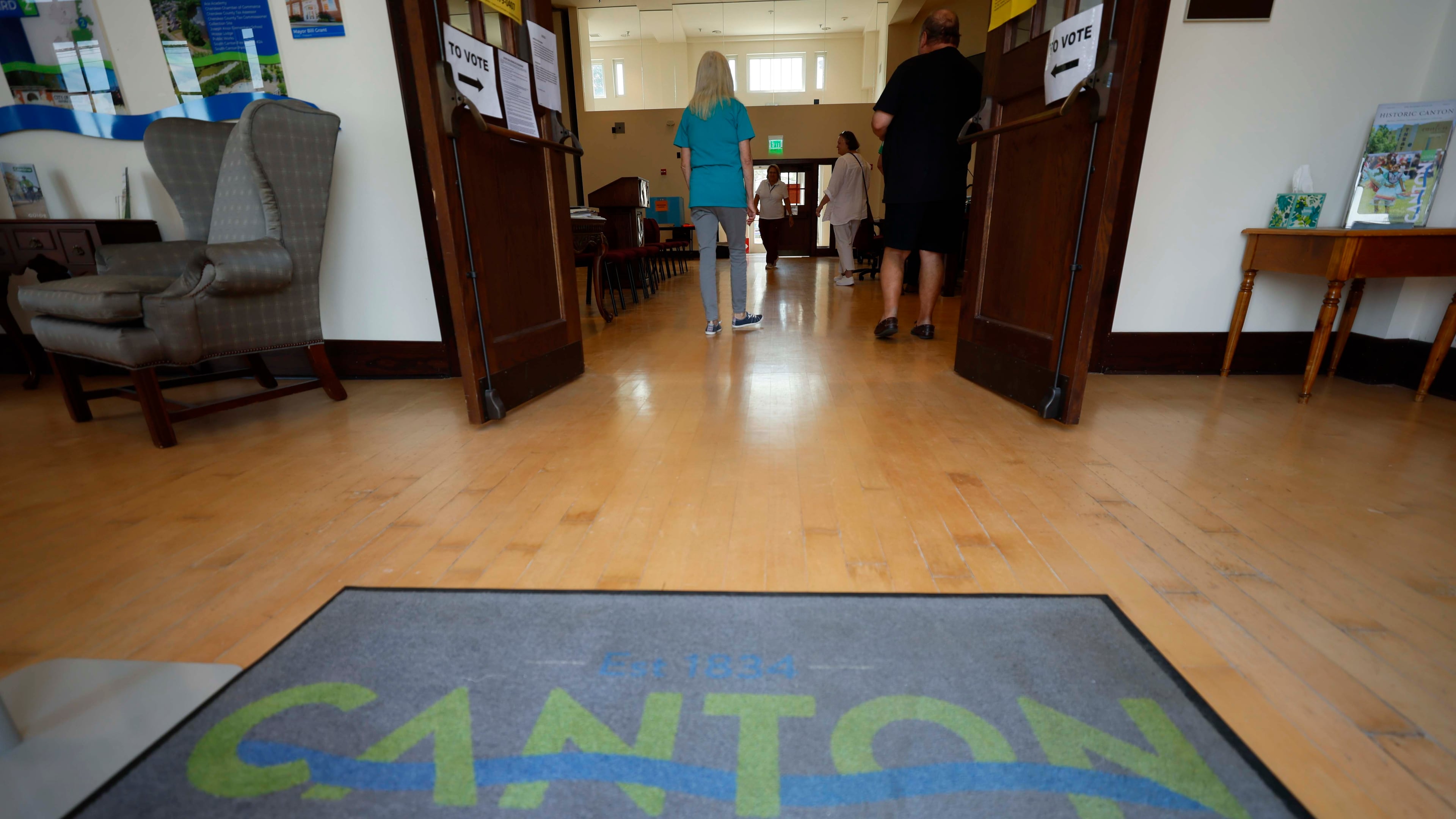 Polling workers and voters are observed inside Canton City Hall during the special election for the state senate seat in Cherokee on Tuesday, August 26, 2025, to fill the remainder of former state Sen. Brandon Beach’s term, which runs through January 2027. (Miguel Martinez/AJC)