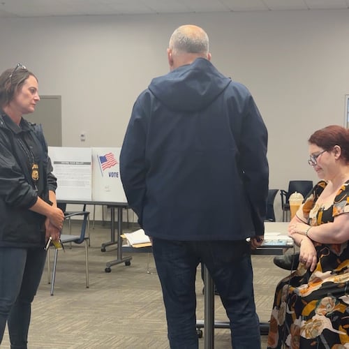 In this image from video provided by Sheilia Milledge, Paigelynne Gonyea, right, is presented with a form at a polling place on Tuesday, June 23, 2026, in Syracuse, N.Y. (Sheilia Milledge via AP)
