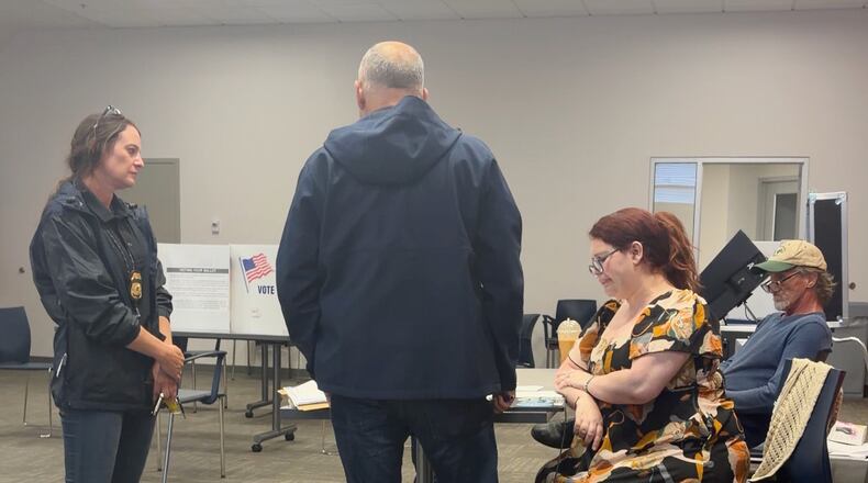 In this image from video provided by Sheilia Milledge, Paigelynne Gonyea, right, is presented with a form at a polling place on Tuesday, June 23, 2026, in Syracuse, N.Y. (Sheilia Milledge via AP)