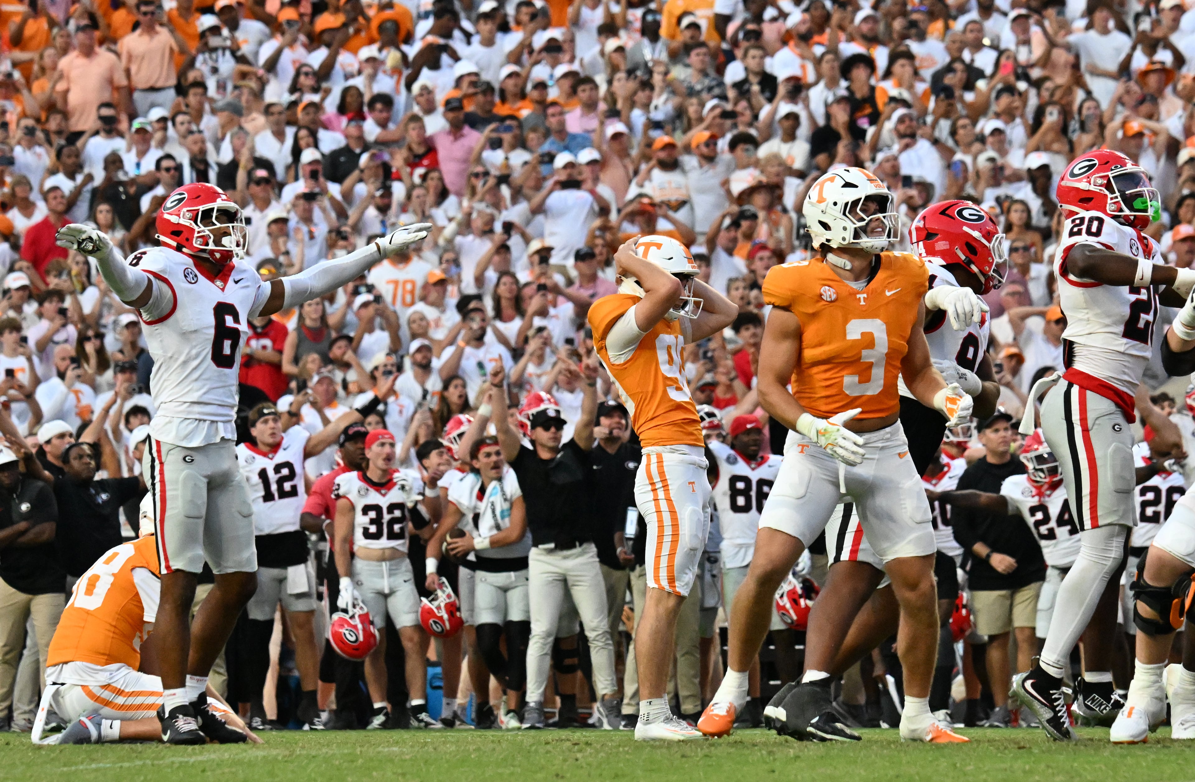 Tennessee place kicker Max Gilbert (center) reacts after missing a field-goal attempt at the end of the fourth quarter against Georgia at Neyland Stadium on Saturday, Sept. 13, 2025, in Knoxville, Tenn. Georgia won 44-41 in overtime. (Hyosub Shin/AJC)