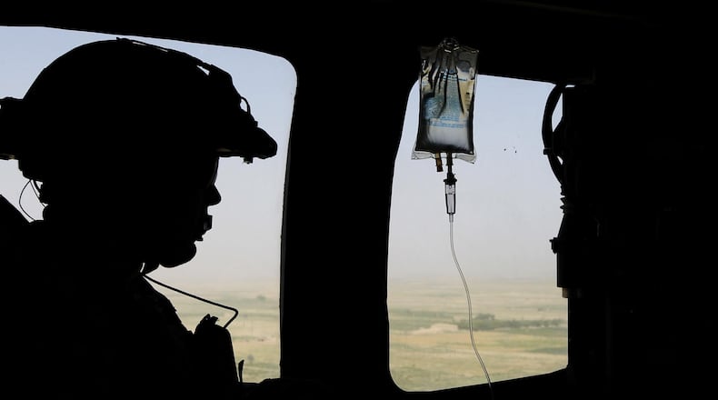 A U.S. Army sergeant from the 101st Airborne Division, shot 13 times in combat, earned his bachelor's degree Saturday at Middle Tennessee State University.