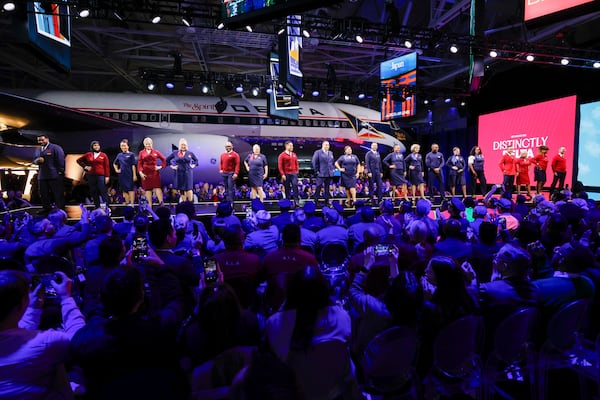 Delta Air Lines employees model the carrier's newest uniforms at the Delta Flight Museum on Monday, Nov. 3, 2025. (Miguel Martinez/AJC)
