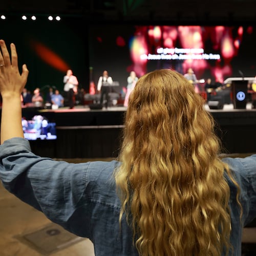 FILE - A messenger attending the Southern Baptist Convention participates in worship during the 2025 SBC Annual Meeting, June 10, 2025, in Dallas. (AP Photo/Richard W. Rodriguez, file)