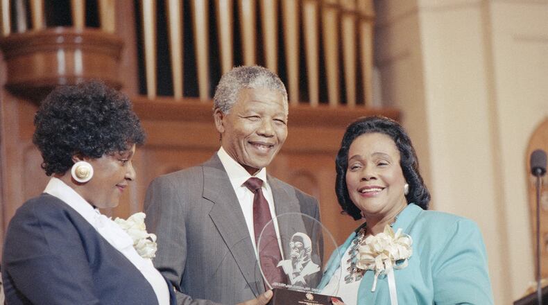 Nelson Mandela receives the Martin Luther king Jr. International Freedom Award from King's widow Coretta Scott King during a ceremony at the Big Bethel AME church in Atlanta Wednesday, June 27, 1990. Mandela is the first recipient of the award. (AP Photo/David Longstreath)