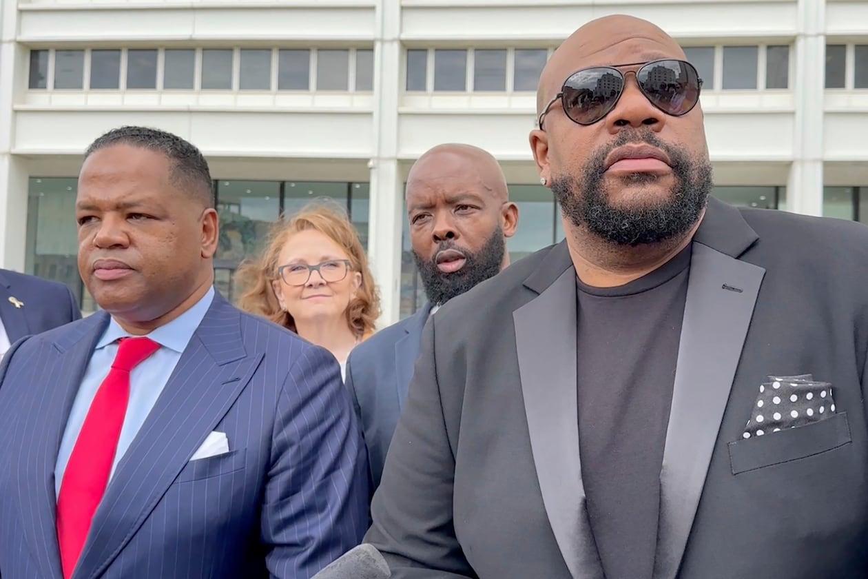 Isaac Hayes III (right) and his attorney address reporters outside a federal courthouse in Atlanta in 2024 after the Hayes estate sued President Donald Trump over using the song “Hold On, I’m Comin’" 134 times without permission during the 2024 presidential campaign. (Kate Brumback/AP 2024)
