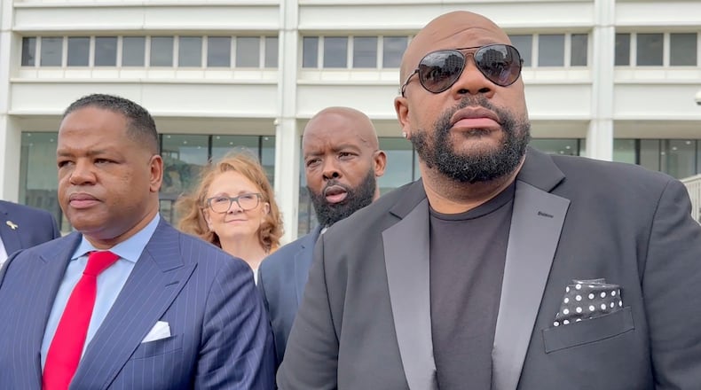 FILE - Isaac Hayes III, right, and his attorney address reporters outside a federal courthouse in Atlanta, Sept. 3, 2024. (AP Photo/Kate Brumback, File)