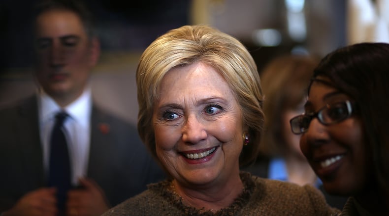 Democratic presidential candidate former Secretary of State Hillary Clinton greets patrons at Mapps Coffee on March 1, 2016 in Minneapolis, Minnesota. (Photo by Justin Sullivan/Getty Images)
