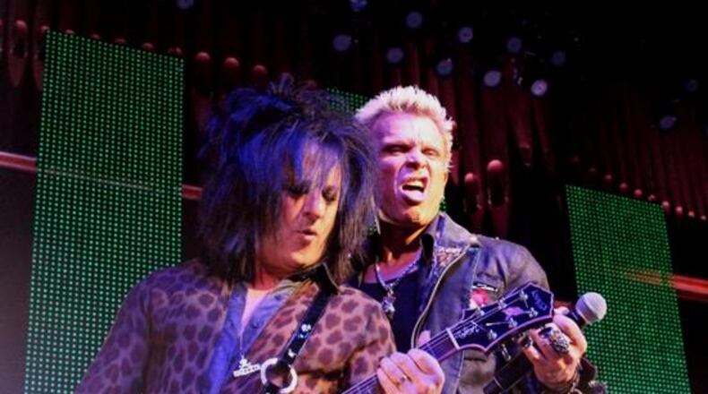 Billy Idol and longtime guitarist Steve Stevens rock a sold-out Tabernacle in June 2013. Photo: Melissa Ruggieri/AJC Billy Idol and longtime guitarist Steve Stevens rock a sold-out Tabernacle in June 2013. They'll return in January. Photo: Melissa Ruggieri/AJC