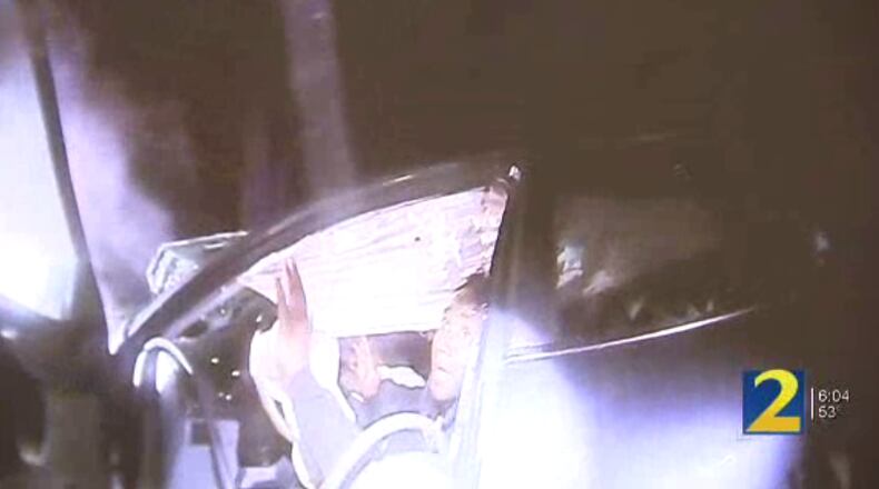 This is a screenshot of body camera video as officers approached the wrecked vehicle Saturday evening.
