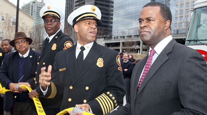 Then-Fire Chief Kelvin Cochran (center) with Atlanta Mayor Kasim Reed in 2011 photo. Phil Skinner
