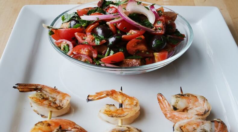 In this Grilled Shrimp with Bread Vegetable Salad recipe, the shrimp is brushed with a mix of olive oil, plenty of fresh lemon juice, garlic, salt and pepper. You can grill, pan-saute, broil or bake the shrimp. (Regina H. Boone/Detroit Free Press/TNS)