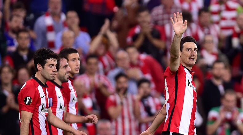 Athletic Bilbao's Aritz Aduriz, right, celebrates his goal and the fifth of his team during their Europa League group L soccer match against Partizan Belgrade, at San Mames stadium, in Bilbao, northern Spain, Thursday, Nov. 5, 2015. (AP Photo/Alvaro Barrientos)