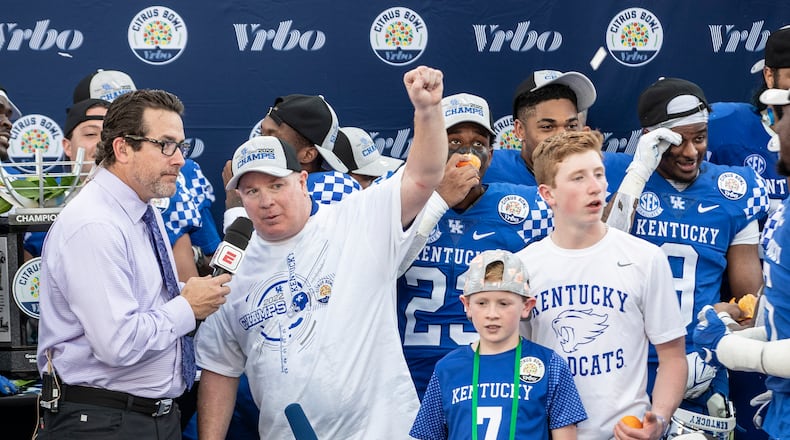 Kentucky Wildcats coach Mark Stoops is interviewed by former Georgia Tech quarterback and new ACC Network broadcaster Tom Luginbill after the VRBO Citrus Bowl in Orlando, Florida, on Jan. 1, 2022. (Willie J. Allen Jr./Orlando Sentinel/TNS)