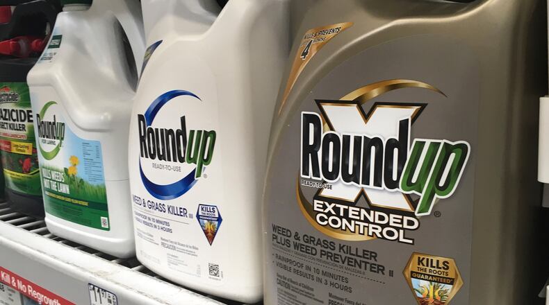 FILE - Containers of Roundup are displayed on a store shelf in San Francisco on Feb. 24, 2019. (AP Photo/Haven Daley, File)