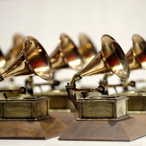 FILE - Grammy Awards are displayed at the Grammy Museum Experience at Prudential Center in Newark, N.J. on Oct. 10, 2017. (AP Photo/Julio Cortez, File)