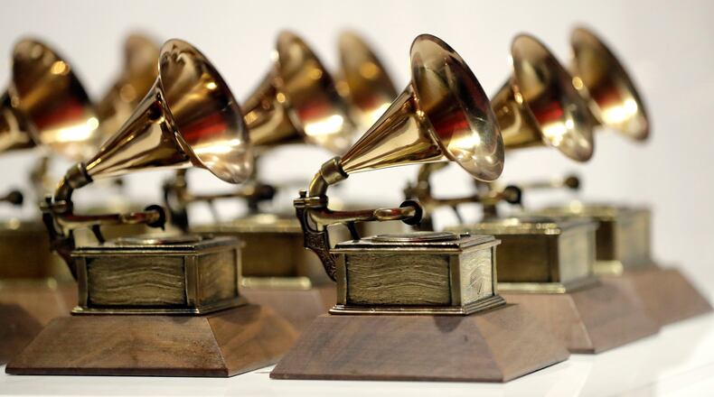 FILE - Grammy Awards are displayed at the Grammy Museum Experience at Prudential Center in Newark, N.J. on Oct. 10, 2017. (AP Photo/Julio Cortez, File)