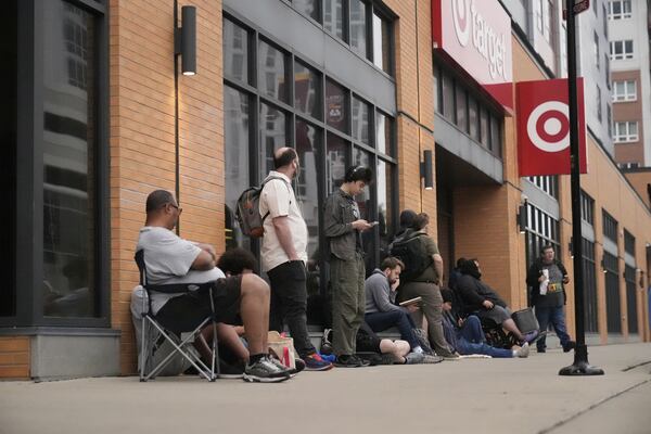 People line up outside a Target store for the new Nintendo Switch 2 video game consoles on Thursday, June 5, 2025 in Chicago. (AP Photo/Kiichiro Sato)