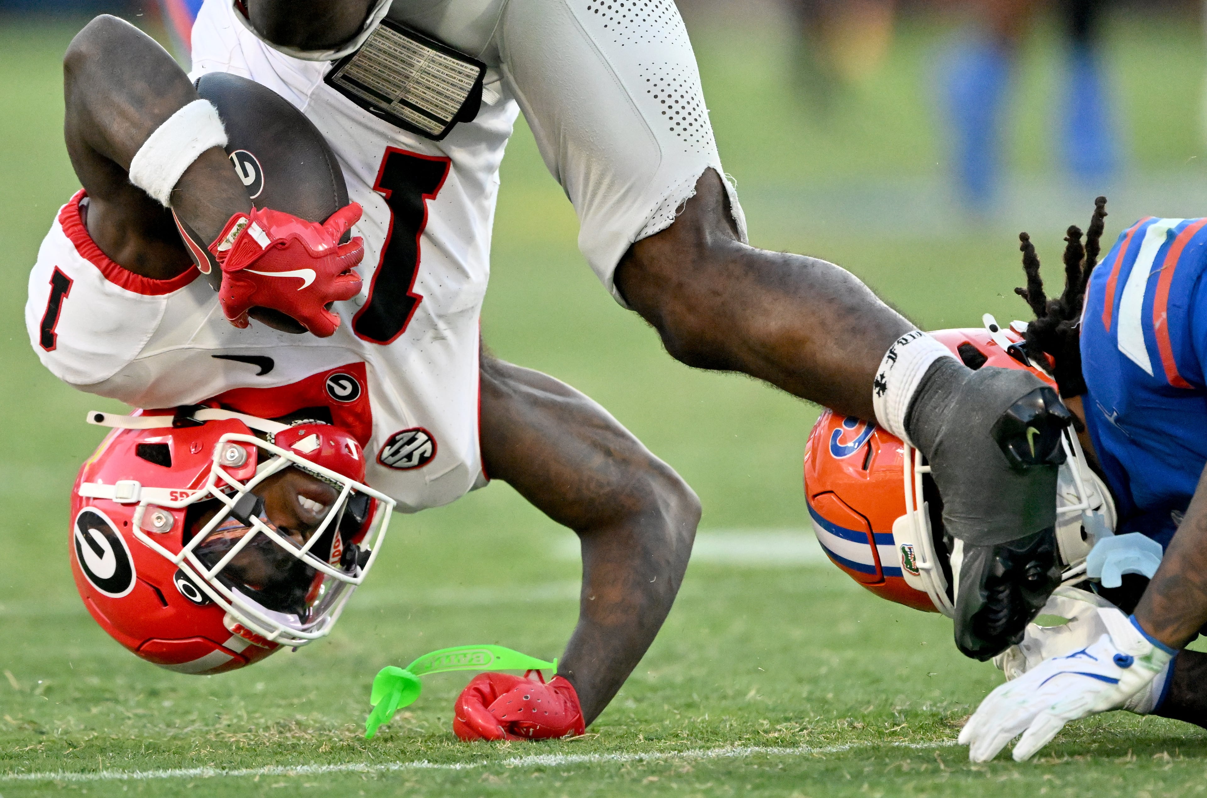 Georgia wide receiver Zachariah Branch (1) falls onto the field after running for a first down during the second half in an NCAA football game, Saturday, November 1, 2025, Jacksonville, Fla. Georgia won 24-20 over Florida. (Hyosub Shin / AJC)