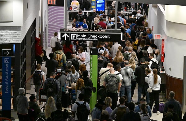 Early Saturday morning, Hartsfield-Jackson Atlanta International Airport posted wait times of more than two hours at the main domestic checkpoint. (Hyosub Shin/AJC)