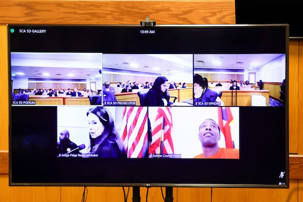 Kelvin Evans (bottom right) attended the hearing before Judge Paige Reese Whitaker via video. (Miguel Martinez/AJC)