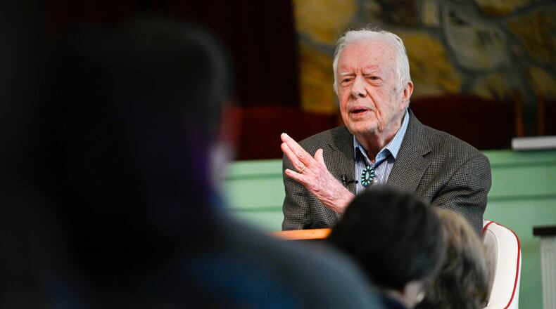 In this Nov. 3, 2019, file photo, former President Jimmy Carter teaches Sunday school at Maranatha Baptist Church, in Plains, Ga. Former President Carter called Wednesday, June 3, 2020, for Americans in positions of power and influence to fight racial injustice, saying “silence can be as deadly as violence.”
