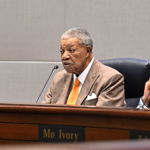 Robb Pitts (left) speaks as Mo Ivory listens during a meeting at the Fulton County Government Center on Wednesday, Feb. 4, 2026, in Atlanta. Pitts has been chairman of the Fulton County Commission since 2017. (Hyosub Shin/AJC)