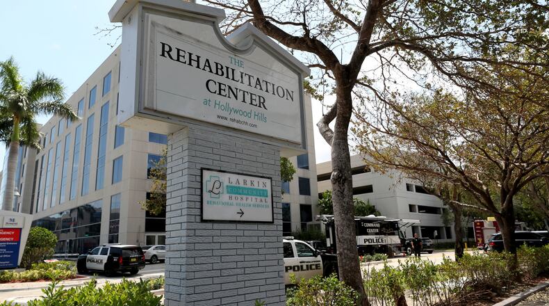 Police surround the Rehabilitation Center in Hollywood Hills, Fla., on Sept. 13, 2017. The home had had no air conditioning after Hurricane Irma knocked out power. Multiple people died and patients had to be moved out of the facility, many of them on stretchers or in wheelchairs. Authorities have launched a criminal investigation to figure out what went wrong and who, if anyone, was to blame.