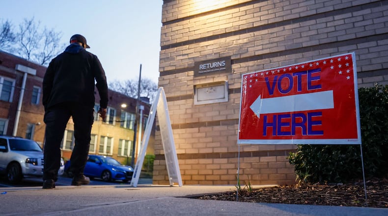 A person walks into the Joan P. Garner Library at Ponce De Leon as the polls open for Georgia for the presidential primary on Tuesday, March 12, 2024. Miguel Martinez/The Atlanta Journal-Constitution/TNS)