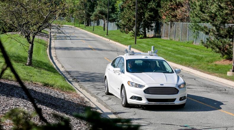 In an undated handout photo provided by the automaker, a self-driving Ford Fusion Hybrid is tested near the company?s headquarters in Dearborn, Mich. The state of Michigan has gotten behind the big automakers in their race with Silicon Valley to build autonomous vehicles. (Ford via The New York Times) — — NO SALES; FOR EDITORIAL USE ONLY WITH STORY SLUGGED SELF DRIVING DEVELOPMENT BY BOUDETTE AND VLASIC FOR DEC. 22 2016. ALL OTHER USE PROHIBITED. ?