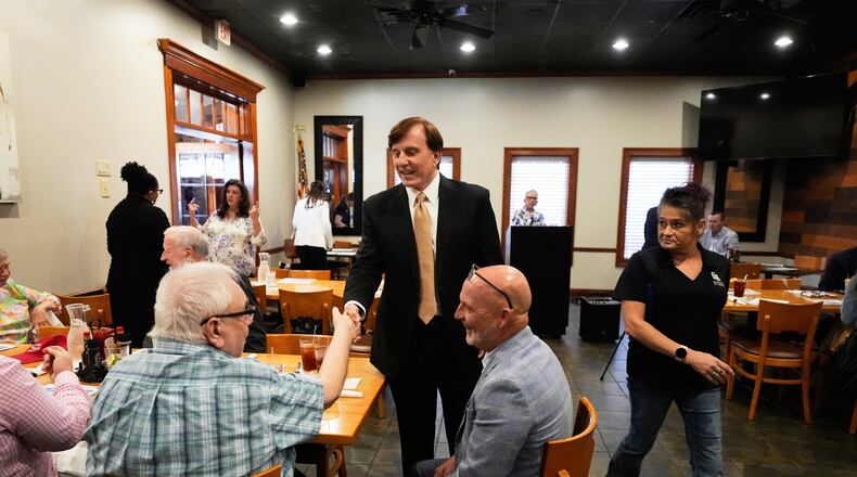 FILE - John Fleming, a U.S. Senate candidate, current Louisiana treasurer and former Republican House representative of Louisiana, greets supporters at a Ronald Reagan Newsmaker Luncheon in Baton Rouge, La., May 12, 2026. (AP Photo/Gerald Herbert, File)