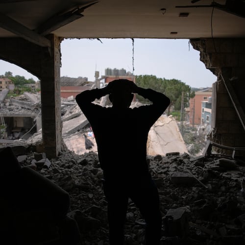 Assem Abdallah reacts as he enters his friend apartment destroyed in a Israeli airstrike in Kfar Roumman, southern Lebanon, Friday, April 17, 2026, following a ceasefire between Israel and Hezbollah. (AP Photo/Hassan Ammar)