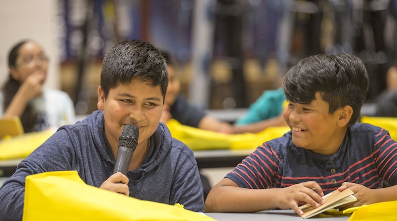 Lilburn Middle School student Andres Rodriguez (left) talks with to his peers about what he has learned from Georgia State Rep. Brenda Lopez Romero during the Hispanic Mentoring Priority Summer Program for the Gwinnett County Public Schools at Meadowcreek High School in Norcross, on Monday, July 15, 2019. Rep. Brenda Lopez Romero talked with students about her career pathway and encouraged them to never give up. ALYSSA POINTER/ALYSSA.POINTER@AJC.COM