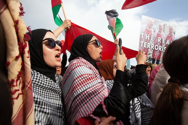 Protesters demonstrate outside the U.S. embassy to condemn military actions in Palestine, Yemen, and Syria, Saturday, April 5, 2025 in Tunis. (AP Photo/Ons Abid) f