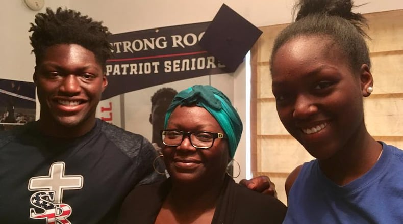 Georgia Tech freshman quarterback Demetrius Knight with his mother Stephanie ( middle) and sister Knyla at their home in Hampton. Knight is interested in studying industrial design at Tech and has an interest in designing buildings that could serve as shelters from natural disasters. He said he got the idea from playing a video game called "Just Cause." (Ken Sugiura/AJC)