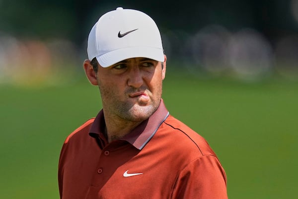 Scottie Scheffler reacts after the 16th hole during the first round of the PGA Championship golf tournament at the Quail Hollow Club, Thursday, May 15, 2025, in Charlotte, N.C. (AP Photo/David J. Phillip)
