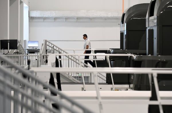 Capt. Toby Lopez, manager of fleet training for United Airlines, exits a simulator at the company's training campus in Denver, Friday, May 16, 2025. (AP Photo/Thomas Peipert)