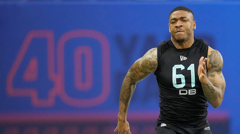 Former Georgia Tech defensive back Juanyeh Thomas runs the 40-yard dash at the NFL scouting combine Sunday in Indianapolis. (AP Photo/Charlie Neibergall)