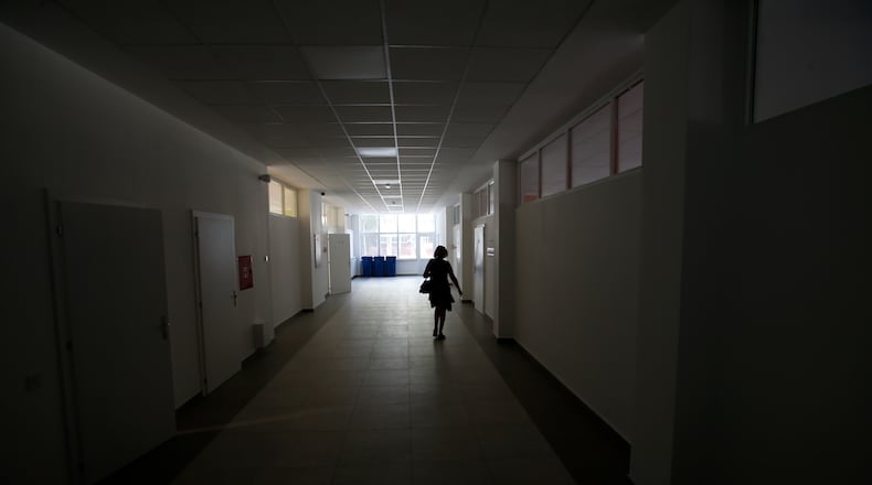 A local teacher says her colleagues nationwide are feeling overwhelmed and under siege. Can this profession be saved?  (AP Photo/Darko Vojinovic)